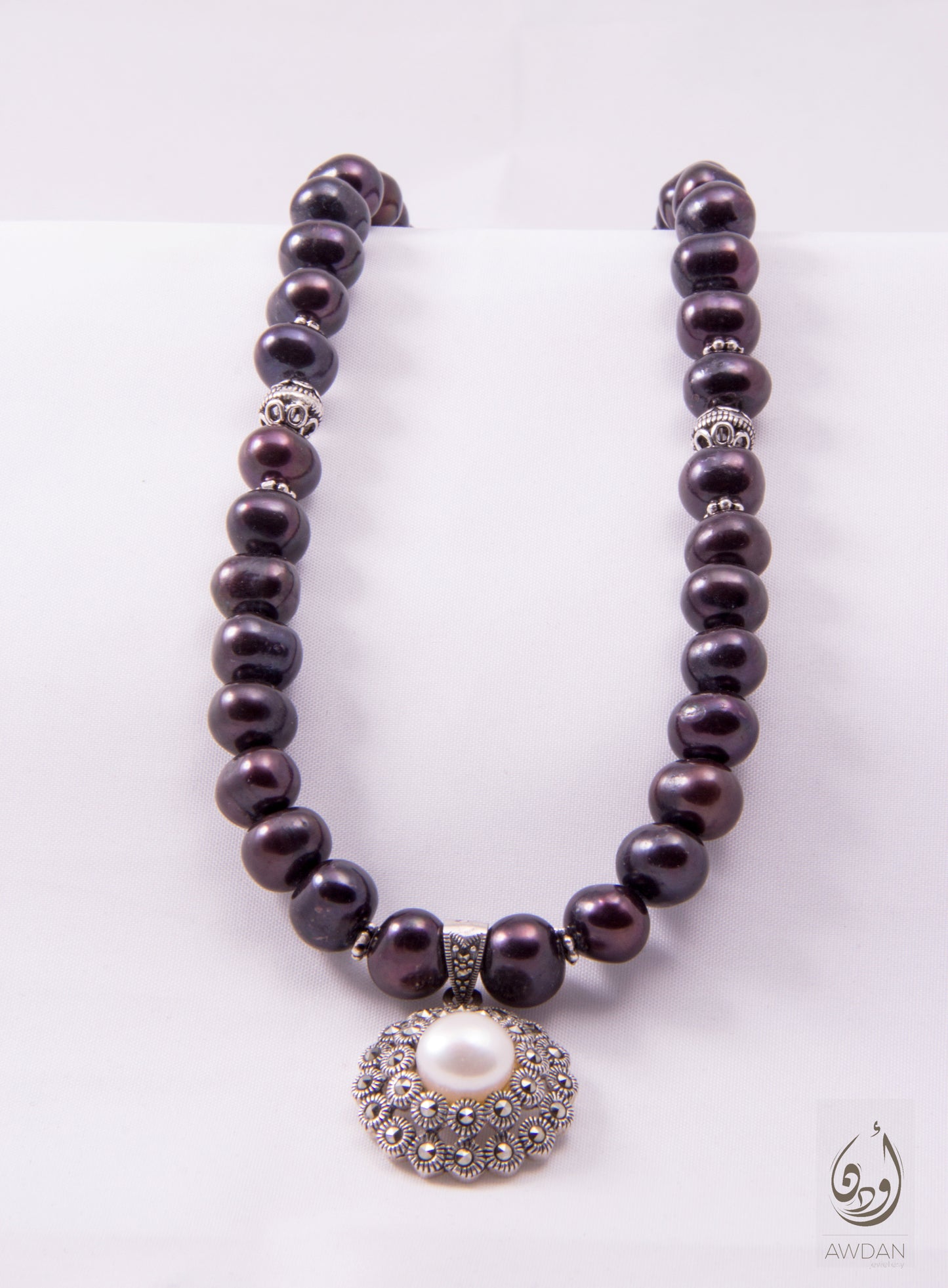 White Pearl Pendant On Black Pearl Necklace