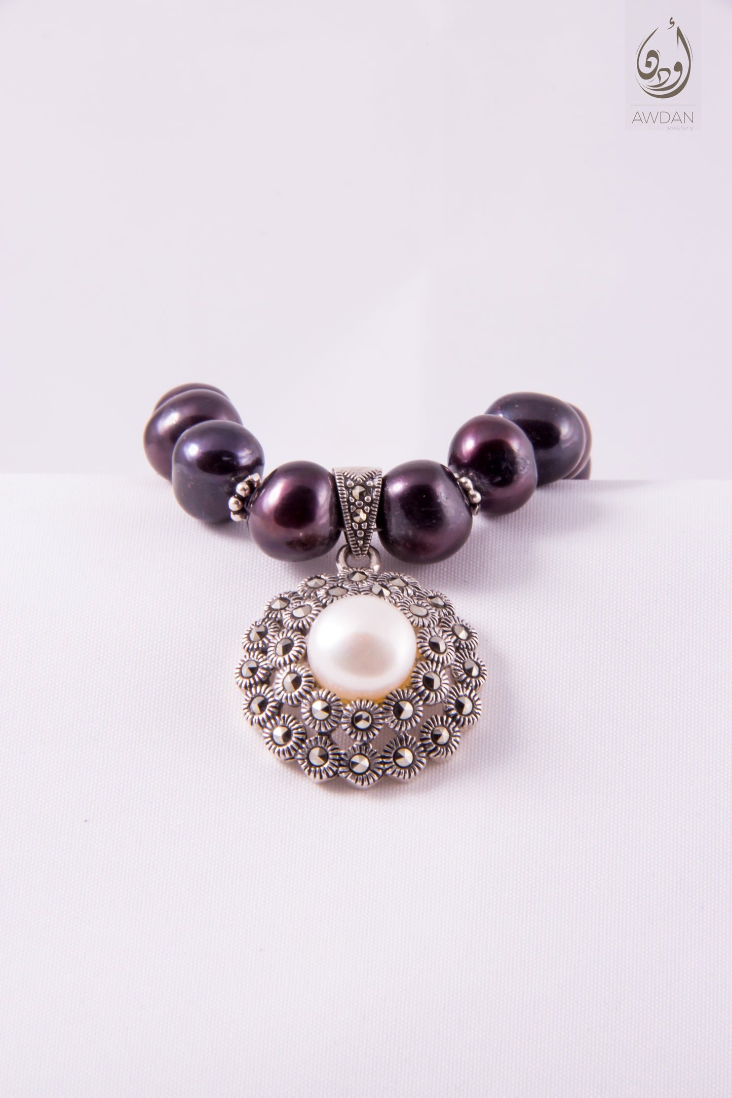 White Pearl Pendant On Black Pearl Necklace